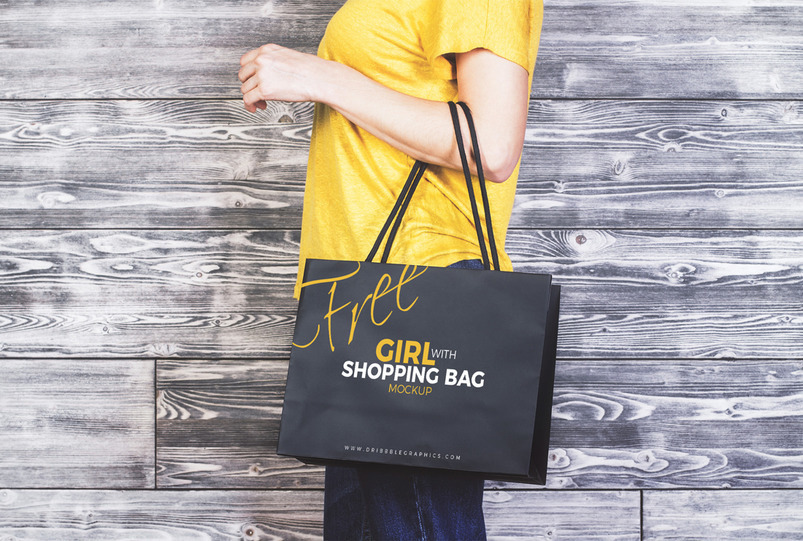 Girl holding shopping bag mockup
