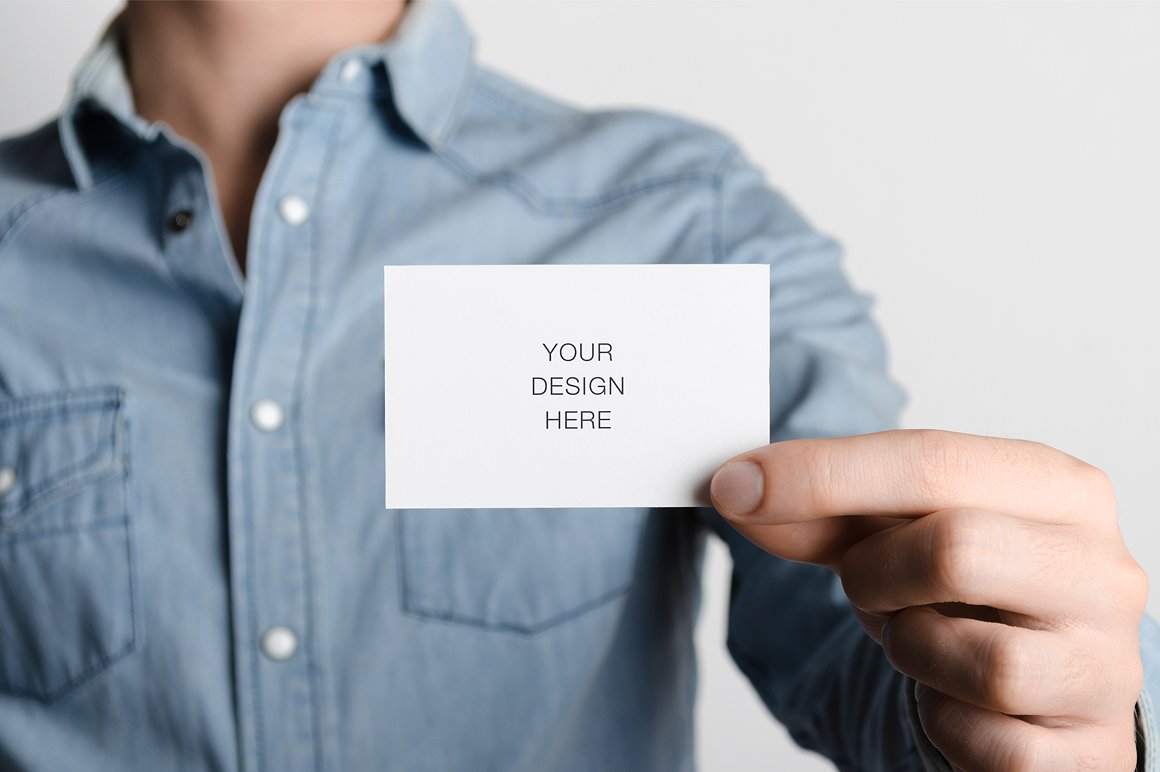 Man showing a business card mockup