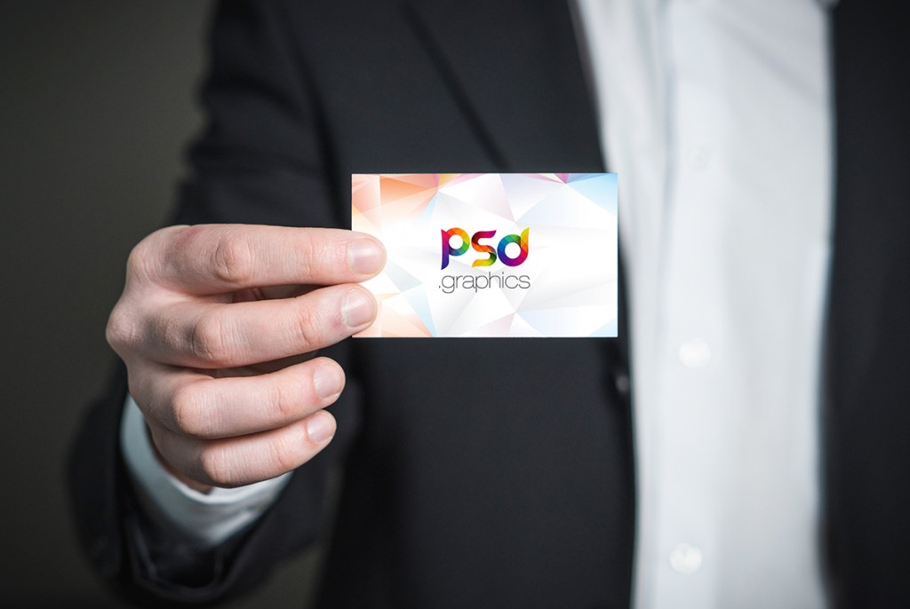 Free man with a business card in hand mockup