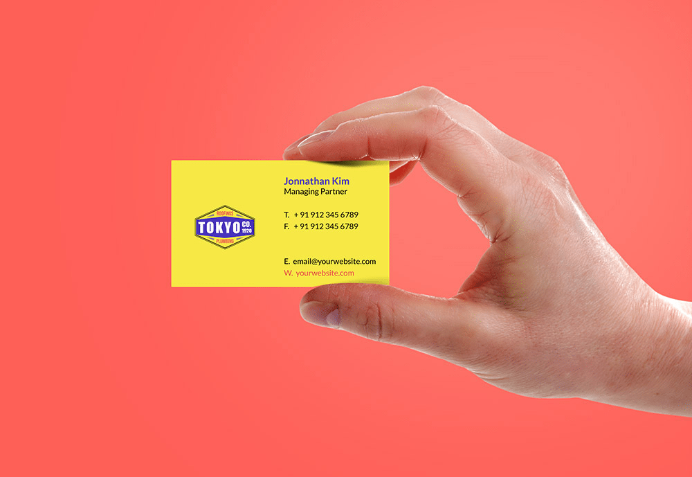 Man hand showing a business card mockup