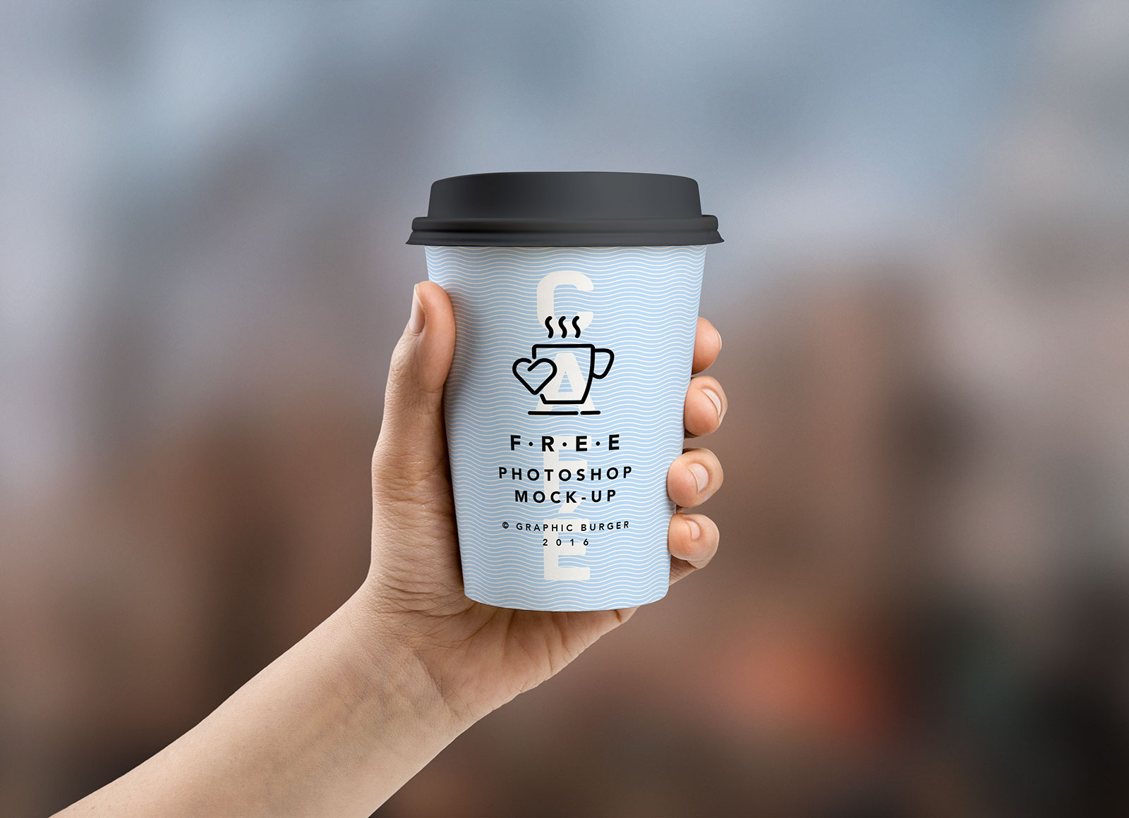Free hand holding coffee cup mockup