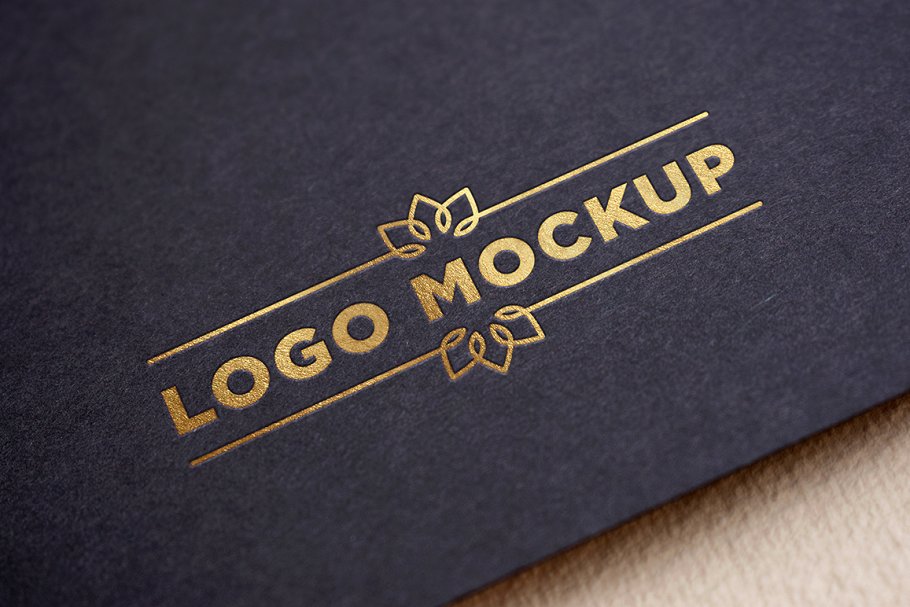 Gold logo mockup on black paper
