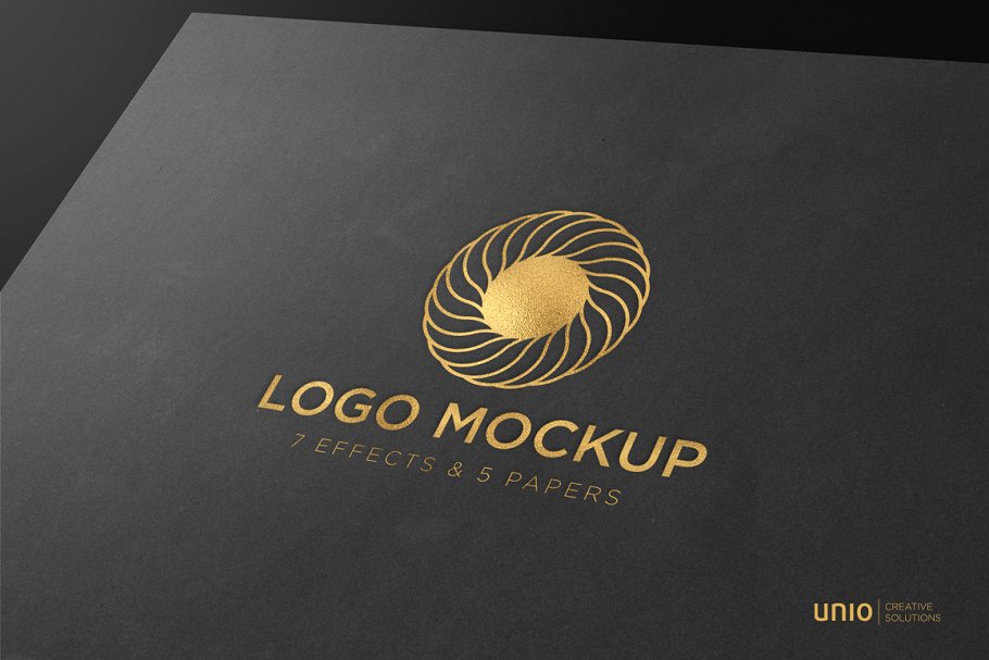 Gold logo on black paper