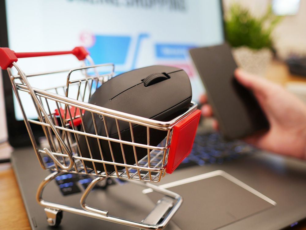 A tinny shopping cart with a mouse inside