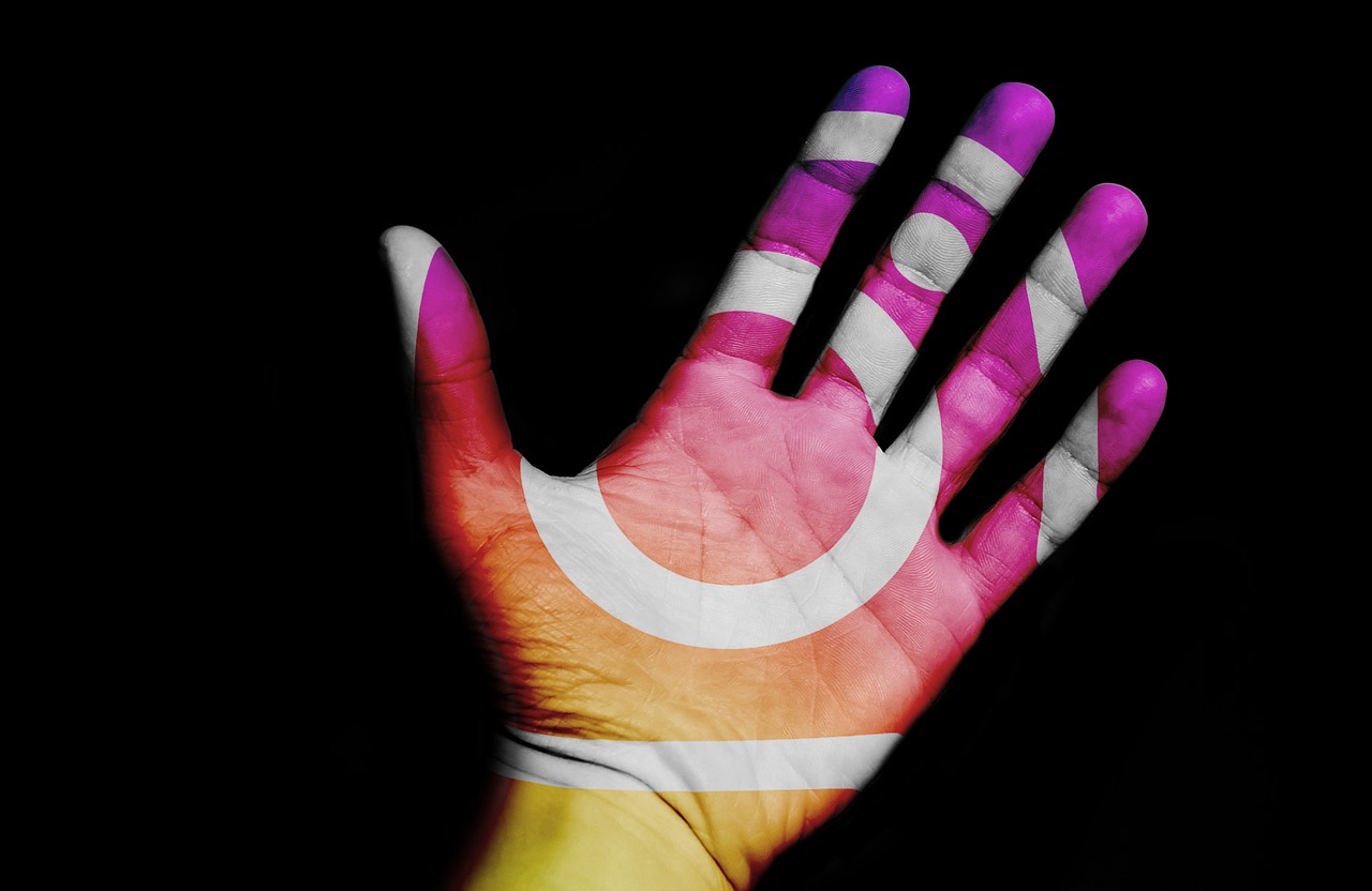 A hand with instagram logo