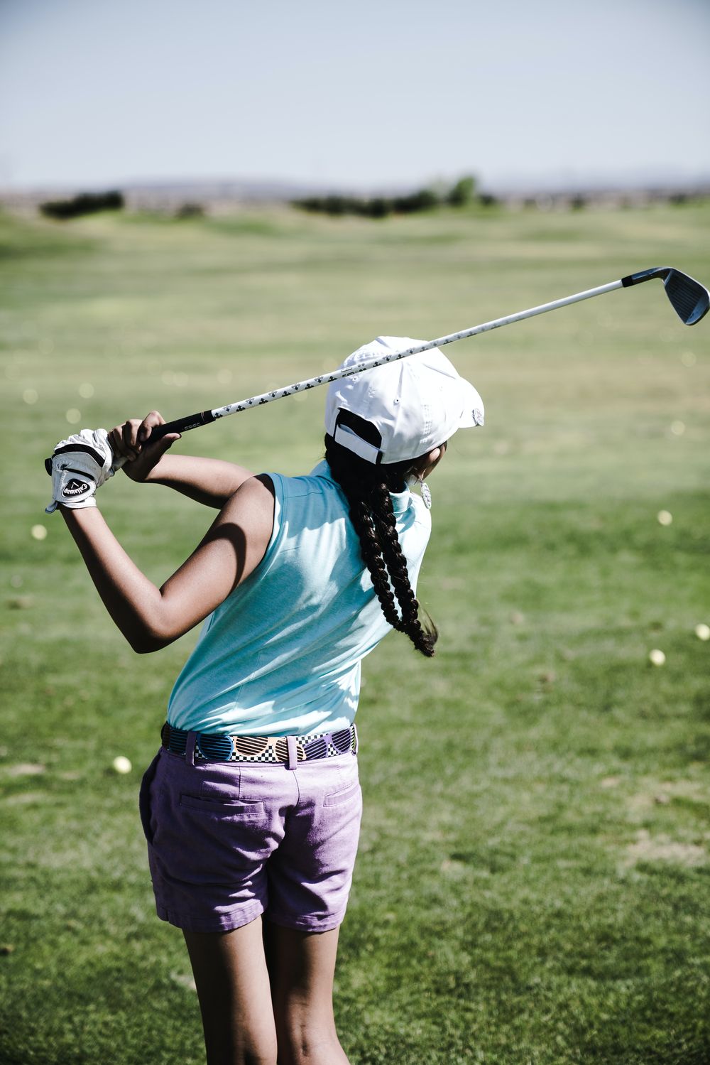 A girl playing golf