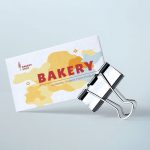 Bakery business card with a binder on sky blue background