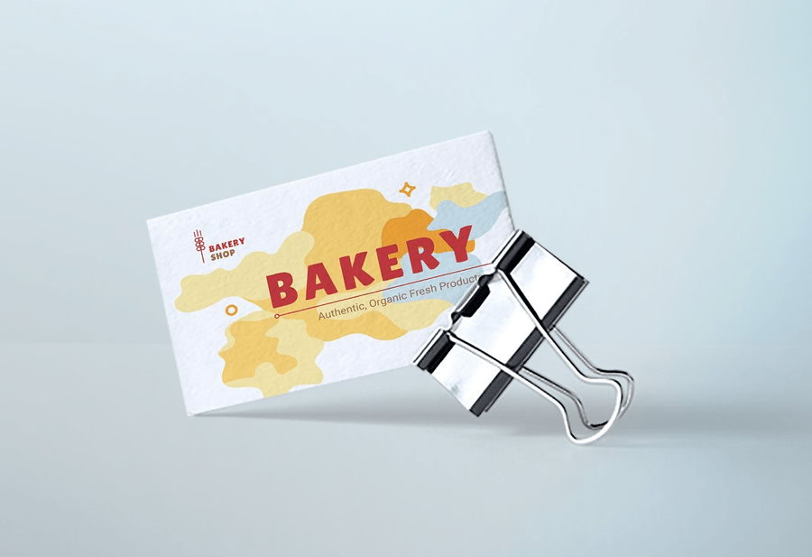 Bakery business card with a binder on sky blue background