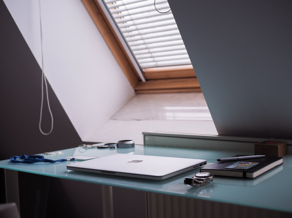 A desk with closed computer