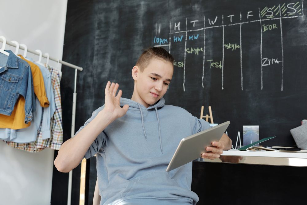 A young boy with ipad in hand