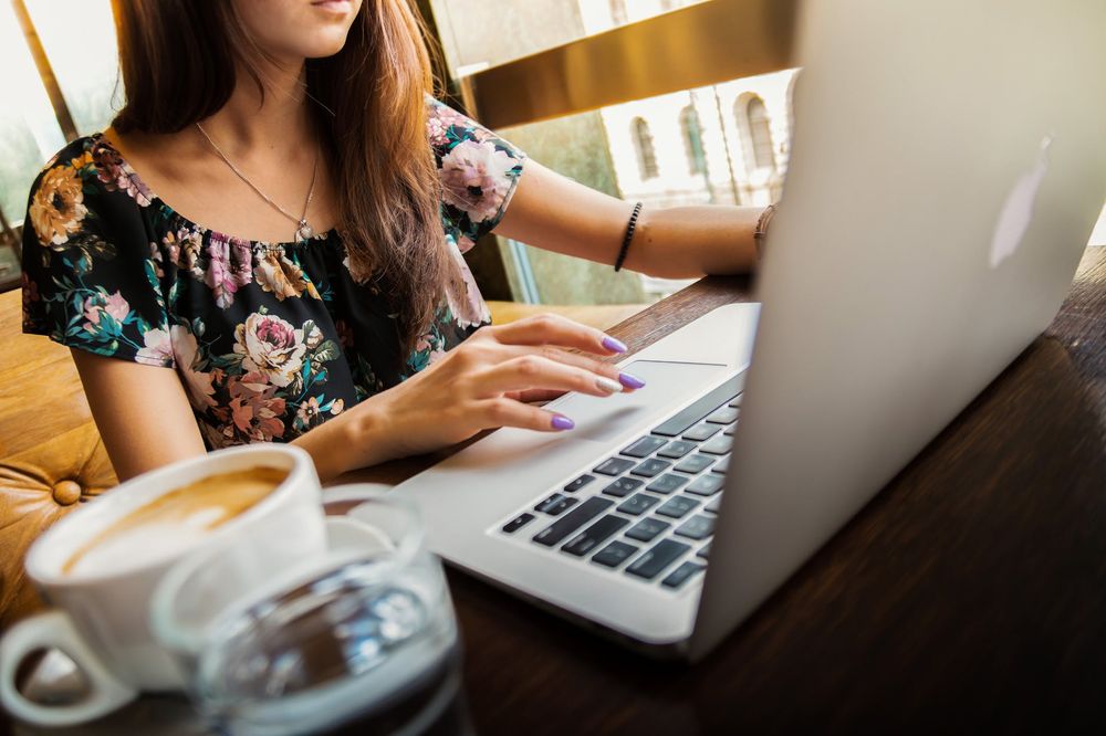 A woman working with macbook