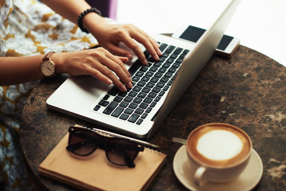 Woman typing on computer