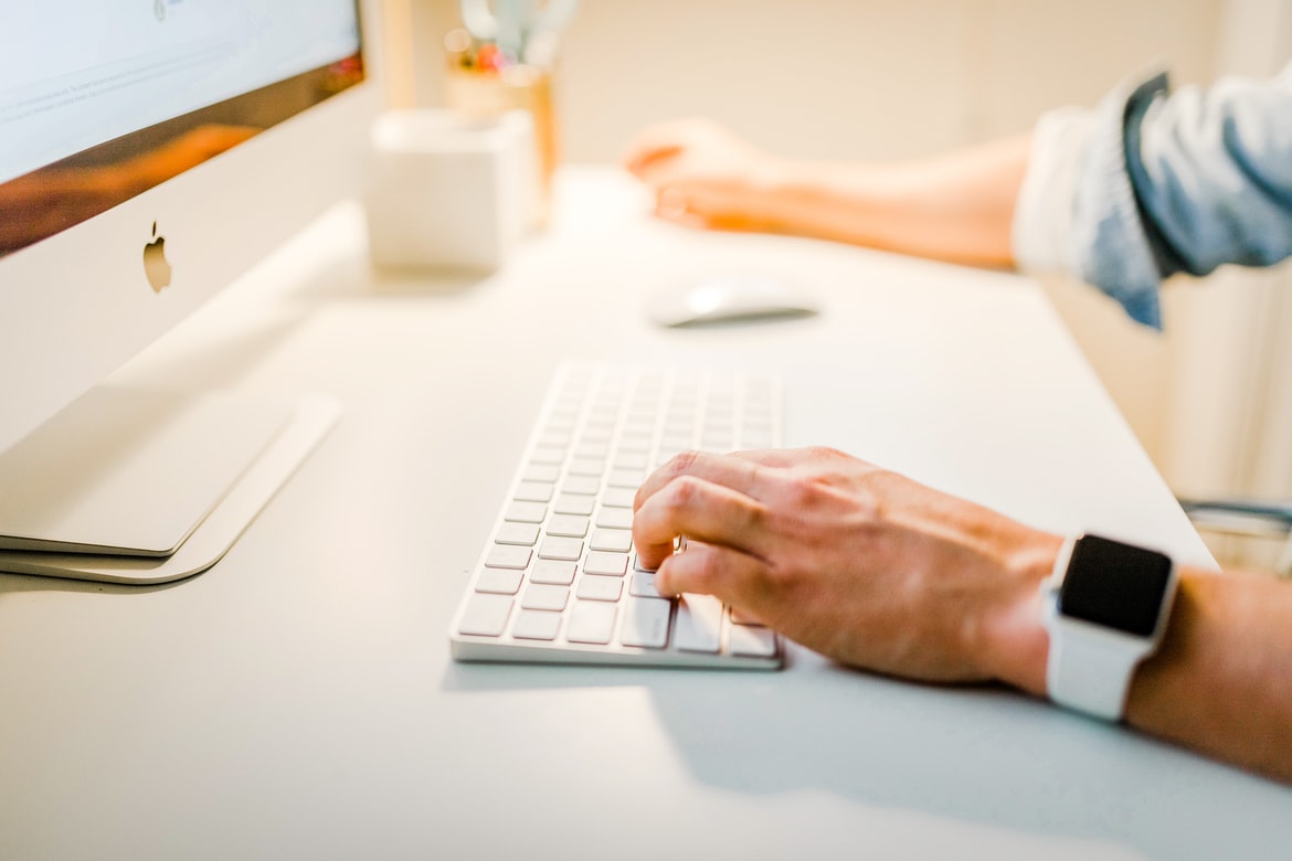 A man working with iMac