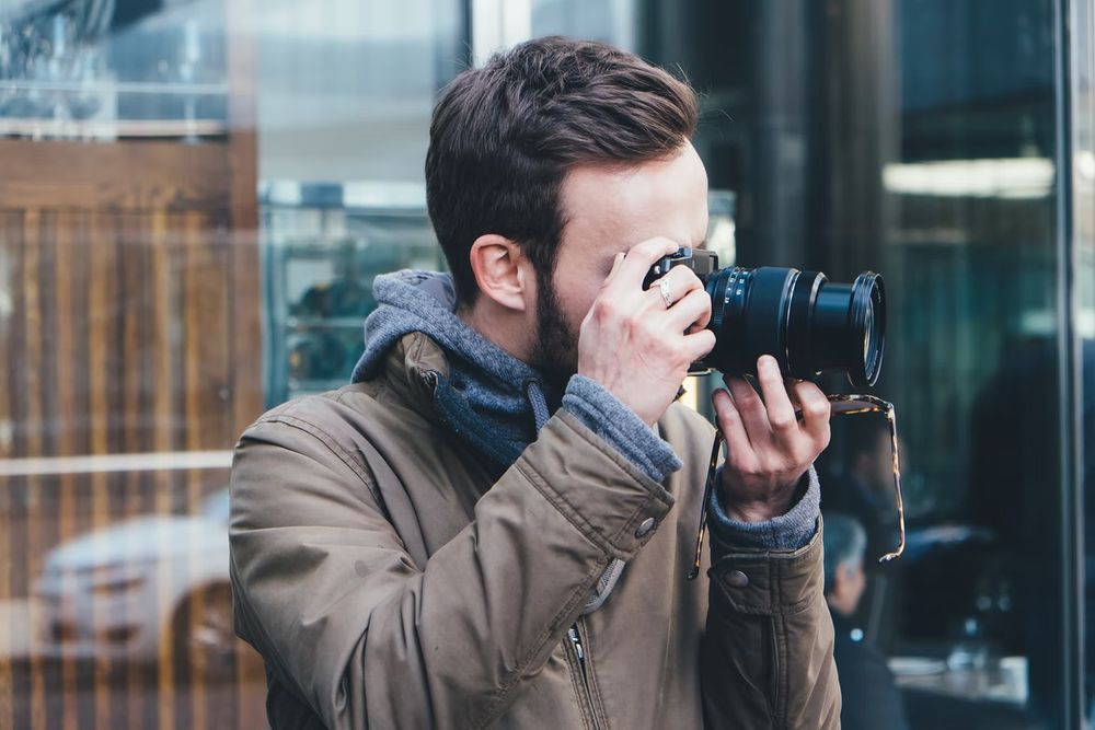 A man taking the photo with camera