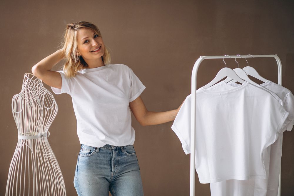 A wooman shwing white t-shirts