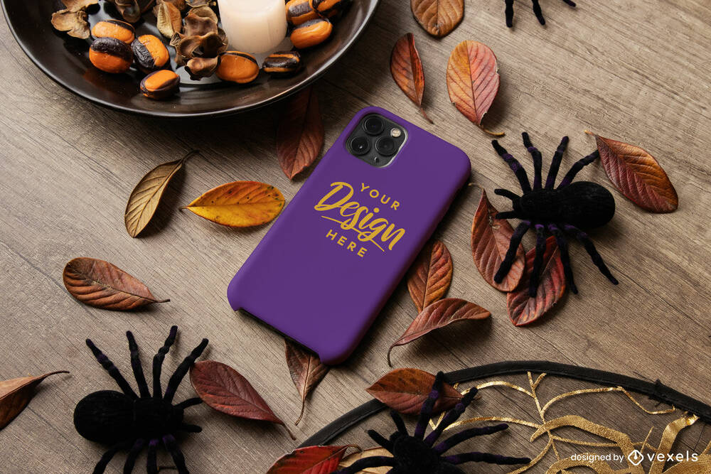 Phone in halloween decorated background