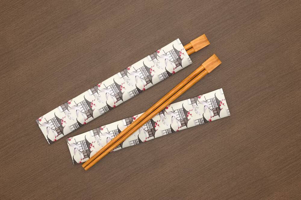 A set of chopsticks on the wooden background