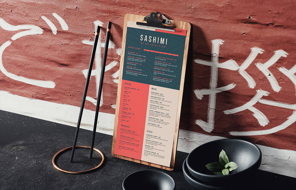 Menu and chopsticks standing by the wall